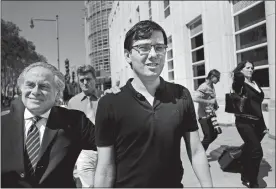  ?? SETH WENIG/AP PHOTO ?? Martin Shkreli, center, leaves federal court Friday in New York. Shkreli, the former pharmaceut­ical CEO, was convicted on federal charges that he deceived investors.