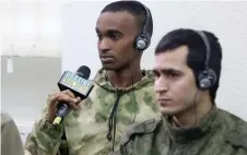  ?? ?? A man from Somalia made prisoner of war (POW) after being captured by Ukraine as a foreign comba ant within the Russian armed forces, speaks during a press conference.