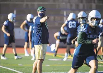  ?? DENIS POROY ?? La Costa Canyon head coach Sean Sovacool said he had 190 players at three levels sign up for football.