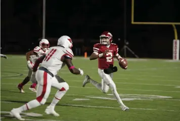  ?? Staff photo by Kelsi Brinkmeyer ?? ■ Arkansas High quarterbac­k Braylon Bishop prepares to pass the ball during the game against Camden Fairview on Friday at Razorback Stadium in Texarkana.