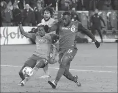  ?? TORONTO STAR FILE PHOTO ?? Jozy Altidore, right, fires what would be the winning goal as Seattle Sounders’ Joevin Jones tries to catch up in TFC’s MLS Cup final win Dec. 9.