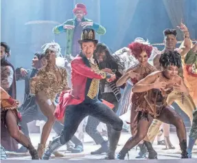  ?? NIKO TAVERNISE ?? P.T. Barnum (Hugh Jackman) creates a family of circus stars out of society’s outcasts in the musical “The Greatest Showman.”