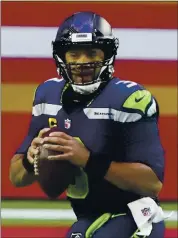  ?? RICK SCUTERI — THE ASSOCIATED PRESS ?? Russell Wilson’s agent says the Seahawks QB would only accept a trade to four teams, one of them the Raiders.