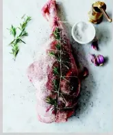  ??  ?? CLASSIC BUTCHER'S TIE Loop one long piece of cotton butcher's twine around the leg of lamb to create an even shape and hold the rosemary. As well as giving a tidier appearance, it will help the meat to roast consistent­ly.