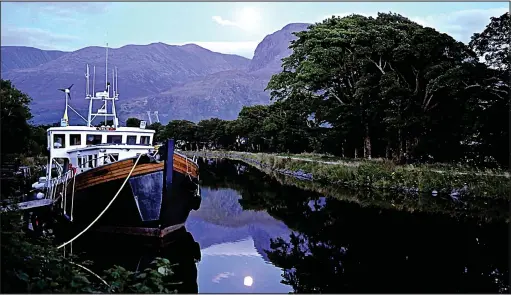  ??  ?? Scenic: The former trawler Orlik is berthed in the Caledonian Canal, with Ben Nevis forming a formidable backdrop