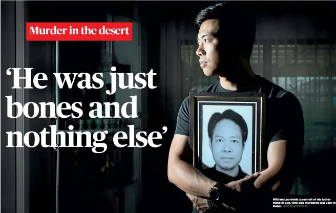  ?? CHRIS MCKEEN/STUFF ?? William Luo holds a portrait of his father Hong Xi Luo, who was murdered last year in Dubai.