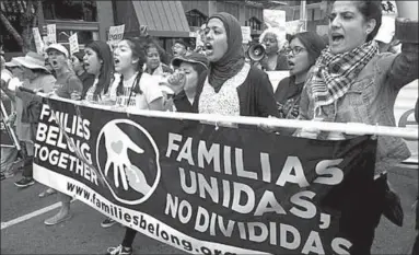  ??  ?? Marchers in San Diego protest against the separation of families detained at the US-Mexico border. (Photo: EPA)