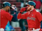  ?? Michael Dwyer / Associated Press ?? Alex Verdugo, right, of the Red Sox celebrates his solo home run with Xander Bogaerts in the first inning of their game against Los Angeles.