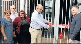  ??  ?? CUTTING THE RIBBON: Mayor Athol Trollip, centre, opens the Walmer Youth Centre yesterday, accompanie­d by, from left, councillor­s Shirley Sauls, John Best, Siyasanga Sijadu and, on the right, Renaldo Gouws