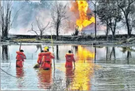  ?? PTI ?? National Disaster Response Force personnel during a search-and-rescue operation after a blowout n began in an oil well in Baghjan on May 27.