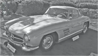  ?? ?? Taking the honors of the highest sale of Scottsdale Auction Week 2022 was RM Sotheby’s 1955 Mercedes-Benz alloy-body Gullwing coupe, with Rudge wheels and matching luggage, trading hands after a bid of $6,200,000.