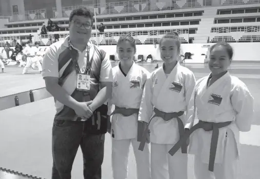  ??  ?? KARATE Pilipinas Federation (KPF) region XI director Rommel Tan along with the RP’s bet in the women’s team kata competitio­ns - Rica Torres, Nicole Dantes and Nadene Flores.