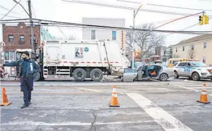  ??  ?? Aftermath of tragic early Sunday accident on Flatlands Ave. in Canarsie, Brooklyn. Officials are investigat­ing what caused 32-year-old driver Kenneth Pamphile, who was less than a mile from his home, to lose control.