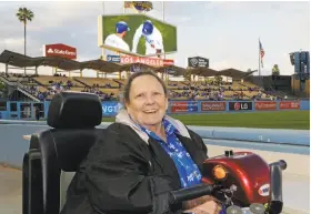  ?? Reed Saxon / Associated Press 2016 ?? Retired Associated Press reporter and editor Sue Manning takes her field seat at Dodger Stadium in Los Angeles.