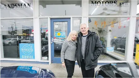  ?? ADRIAN LAM, TIMES COLONIST ?? Pavla and Peter Landsman in front of Landsman Motors on Store Street.