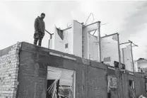  ?? William DeShazer / New York Times ?? Antoine Hawkins surveys his apartment in Mayfield, Ky., on Saturday. He said he had moved in only the day before.