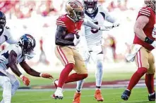  ?? Thearon W. Henderson/Getty Images ?? Deebo Samuel played just the first series in 49ers’ win Saturday, but he made quite an impression with two catches for 39 yards.