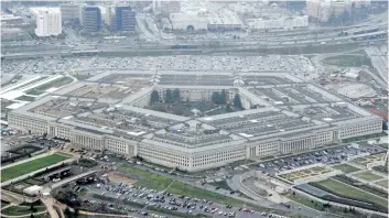  ?? CHARLES DHARAPAK/AP ?? An aerial view of the Pentagon is seen in this file photo. U.S. President Donald Trump said Wednesday he will bar transgende­r individual­s from serving “in any capacity” in the armed forces.