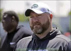  ?? SETH WENIG ?? New York Jets general manager Joe Douglas greets reporters during a practice at the team’s NFL football training facility in Florham Park, N. J. Douglas is like the rest of the Jets and their fans: He never envisioned such a dreadful start. But here they are, the NFL’S only winless team and a loss away from being the first in franchise history to open 0- 9.