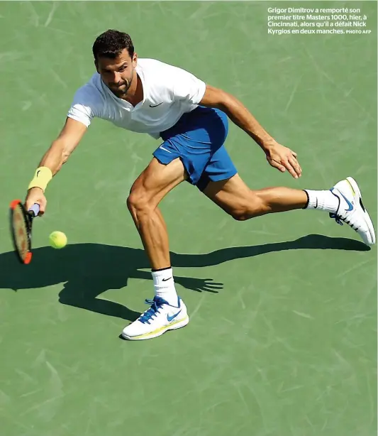  ?? PHOTO AFP ?? Grigor Dimitrov a remporté son premier titre Masters 1000, hier, à Cincinnati, alors qu’il a défait Nick Kyrgios en deux manches.