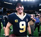  ?? Butch Dill/AP ?? ■ New Orleans Saints quarterbac­k Drew Brees
smiles after defeating the Indianapol­is Colts 34-7 on Dec. 16,
2019, in New Orleans. A person familiar with the situation says the Saints and record-setting quarterbac­k have agreed on a twoyear, $50 million
contract.