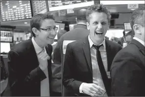  ?? AP/RICHARD DREW ?? Box Inc. co-founder and Chief Executive Aaron Levie (right) and the company’s chief financial officer and co-founder, Dylan Smith, prepare to ring the opening bell Friday at the New York Stock Exchange marking an initial public offering of Box shares...