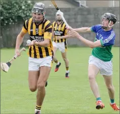  ??  ?? Glen Malone of Shelmalier­s under pressure from Fionn Cooney.