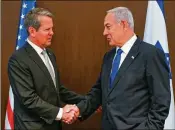  ?? KOBI GIDEON/ISRAEL GPO ?? Gov. Brian Kemp (left) was urged by Israeli Prime Minister Benjamin Netanyahu to support making antisemiti­sm part of Georgia’s hate crimes law when they met in May in Jerusalem.