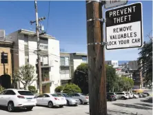  ?? Michael Short / Special to The Chronicle ?? Tourists are warned to protect their valuables near Lombard Street, an area beloved by smash-and-grabbers.