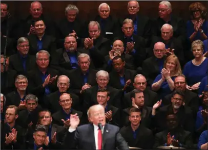  ?? The Associated Press ?? TRUMP: Members of the First Baptist Dallas Church Choir are seated behind President Donald Trump as he speaks Saturday during the Celebrate Freedom event at the Kennedy Center for the Performing Arts in Washington.