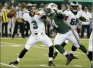  ?? MICHAEL NOBLE JR — THE ASSOCIATED PRESS FILE ?? In this Aug. 31 file photo, New York Jets defensive lineman Kony Ealy, right, moves in to sack Philadelph­ia Eagles quarterbac­k Matt McGloin during the first half of an NFL football game in East Rutherford, N.J.