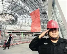  ?? PHOTO: REUTERS ?? A security guard at the terminal hall of new Daxing Airport, Beijing. Meanwhile the US Federal Aviation Authority said that 273 affected parts made in China were installed in an unspecifie­d number of Boeing 777 wing spoilers.
