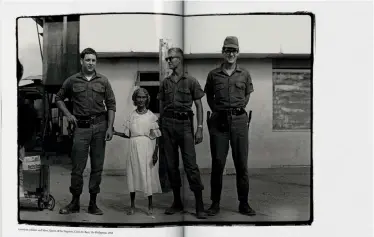  ??  ?? American Soldiers and Mary, Queen of the Negritos, Clark Air Base, The Philippine­s, 1968 © Annie Leibovitz. From Annie Leibovitz Archive Project #1: the early years