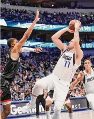  ?? LM Otero/Associated Press ?? Mavericks star Luka Doncic dominated the Rockets, finishing with 35 points, 13 assists and 12 rebounds.