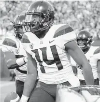  ?? AP ?? Arizona quarterbac­k Khalil Tate celebrates after running for a touchdown against Colorado during the 2017 season. Tate is an experience­d leader who returns to help anchor the Wildcats’ offense.