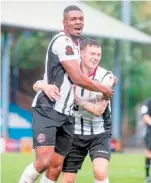  ?? ?? Emile Acquah and Josh Kelly celebrate United's second leveller.