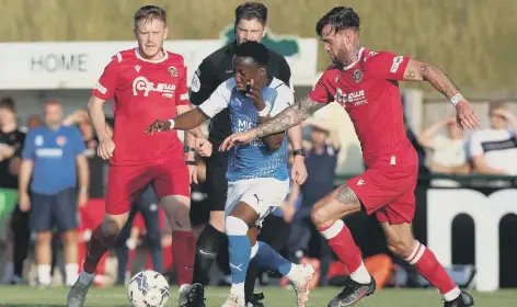  ??  ?? Siriki Dembele (blue) in action for Posh at Stamford on Tuesday.