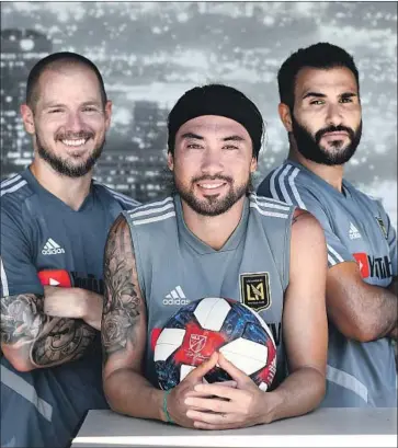  ?? Wally Skalij Los Angeles Times ?? LEE NGUYEN, center, landed a modeling gig with his new look, while Steven Beitashour, right, says his wife is not a fan. The idea started with Jordan Harvey, left, and won’t end until LAFC wins the MLS Cup title.