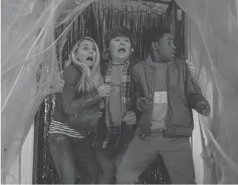  ?? COLUMBIA PICTURES ?? Actors Madison Iseman, left, Jeremy Ray Taylor and Caleel Harris must conquer an evil plan to bring Halloween decoration­s to life in Goosebumps 2: Haunted Halloween.