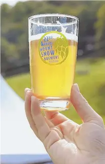  ??  ?? RAISE A GLASS: Souvenir pint glasses keep the fun going at the Mount Snow Brewers Festival, which draws big crowds and features fun games.