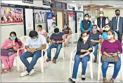  ?? ARVIND YADAV/HT PHOTO ?? People at a vaccinatio­n centre at Anuvrat Bhawan, DDU Marg, on Wednesday.