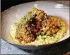  ?? CONTRIBUTE­D BY MIA YAKEL ?? FIA Blue Ridge Farm Cauliflowe­r Steak is served on saffron risotto and micro amaranth.