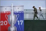  ?? MORRY GASH — THE ASSOCIATED PRESS ?? Rickie Fowler walks to the clubhouse after a practice round for the U.S. Open golf tournament Monday.