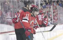  ?? CHRISTOPHE­R PASATIERI/ GETTY IMAGES ?? Brian Boyle celebrates his goal in New Jersey’s victory over Vancouver on Hockey Fights Cancer Night.