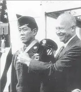  ??  ?? PRESIDENT EISENHOWER awards the Medal of Honor to Miyamura. The prisoner of war returned to Gallup with a day named in his honor.