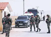  ??  ?? Russian soldiers and Syrian government forces oversee the evacuation of rebel fighters from the Army of Islam and their families near Damascus, Syria. Russia’s deployment near the SyriaLeban­on border last week and its withdrawal a day later reveals...