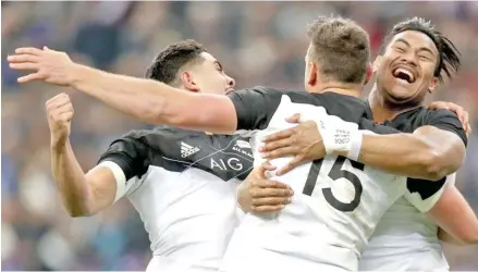  ??  ?? Israel Dagg (15) is congratula­ted by Julian Savea after the scoring the All Blacks first try against France yesterday.