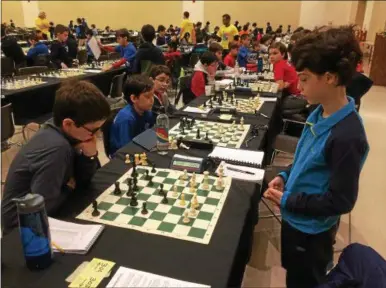  ?? PAUL POST — PPOST@DIGITALFIR­STMEDIA.COM ?? A pair of young competitor­s study each other’s moves during New York state chess championsh­ip play on Sunday.