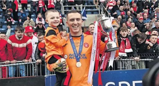  ?? ?? Silver lining Ryan Fulton proudly shows off the SPFL Trust Trophy