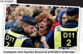  ?? Picture: ERIK SIMANDER/AFP/GETTY IMAGES ?? Flashpoint: Anti-Sweden Democrat protesters yesterday and, dt top, cars on fire fi after ft a riot i ti in a Stockholm St kh l suburb b b